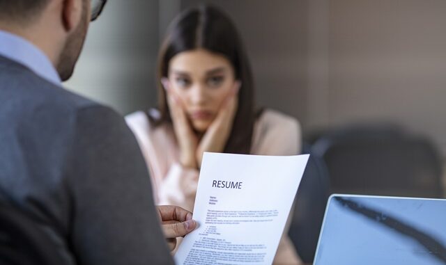 Nervous young job applicant wait for recruiters question