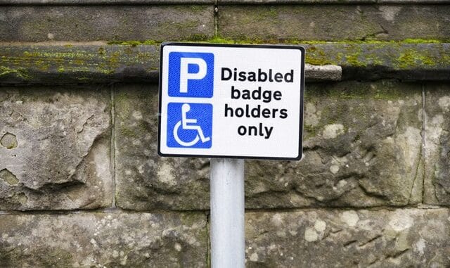Disabled blue badge holder parking sign for driver