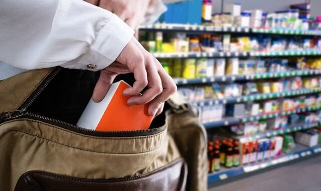 Retail Shoplifting. Woman Stealing In Supermarket. Theft