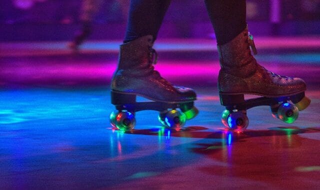 Low Section Of Person Wearing Roller Skates